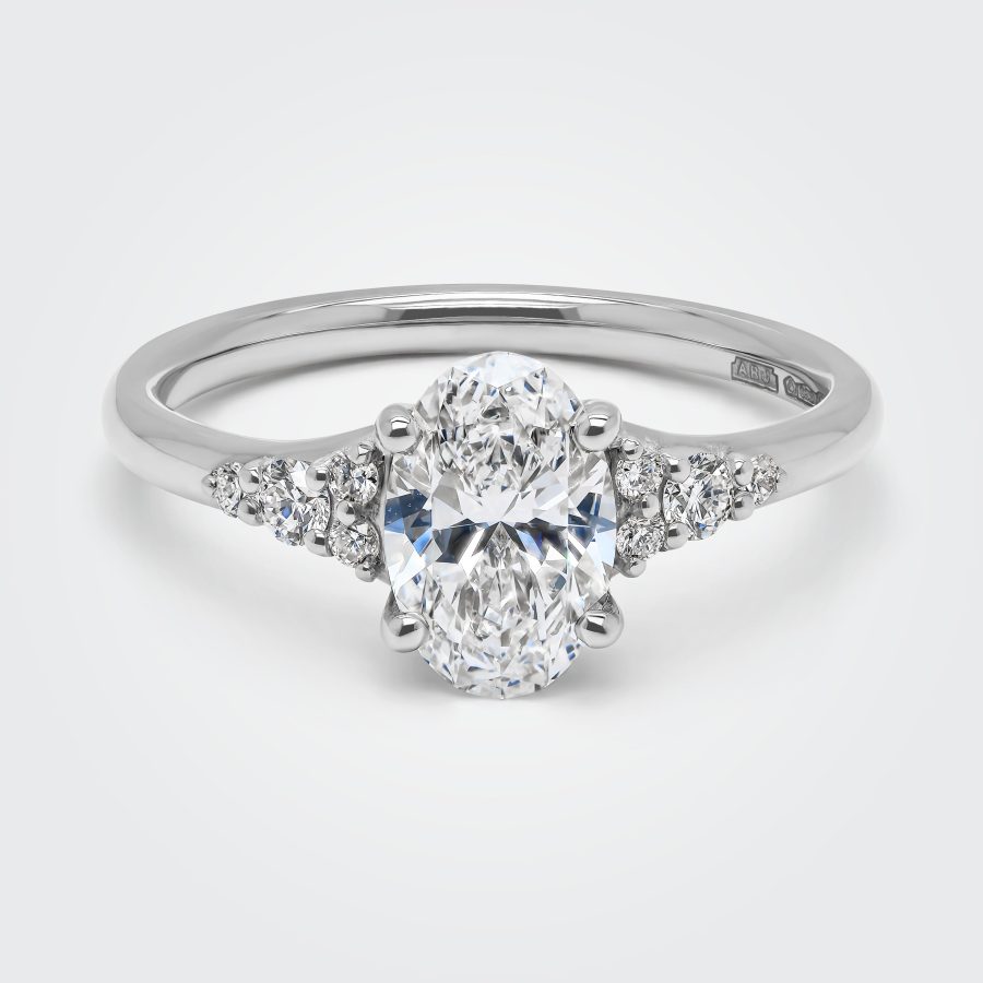 Oval diamond trefoil engagement ring in platinum, handmade in Hatton Garden London by Alan Bick